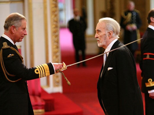 Sir Christopher Lee receives his knighthood from the Prince of Wales at Buckingham Palace