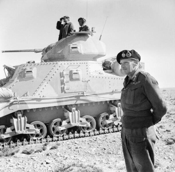 General_Montgomery_stands_beside_a_Grant_command_tank_near_Tripoli,_27_January_1943._E21701