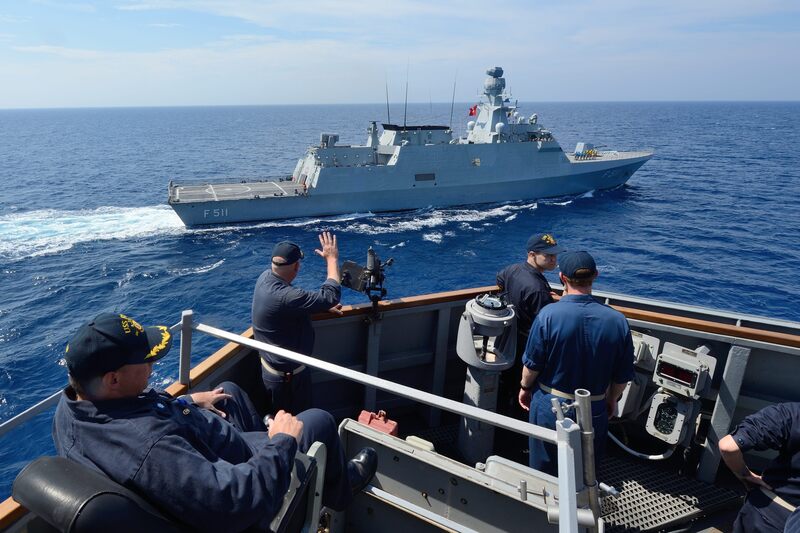 U.S._Navy_Cmdr._Russell_Caldwell_waves_to_the_Turkish_corvette_TCG_Heybeliada_(F_511)_from_aboard_the_guided_missile_destroyer_USS_Ross_(DDG_71)_in_the_Mediterranean_Sea_during_a_passing_exercise_Sept_140902-N-IY14