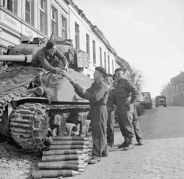 616px-British_Sherman_tank_crew_load_ammunition_Xanten_21-03-1945_IWM_BU_1966