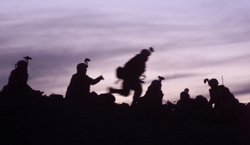 Soldiers_from_the_10th_Mountain_Division_(Light_Infantry),_participating_in_the_Combined_Joint_Task_Force_Mountain's_Operation_Anaconda,_prepare_to_dig_into_fighting_positions_after_a_day_of_reacting_to_enemy_fire,_March_2002